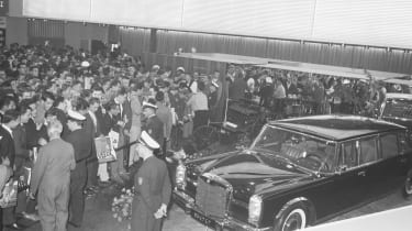 Mercedes 600 amongst motor show crowd